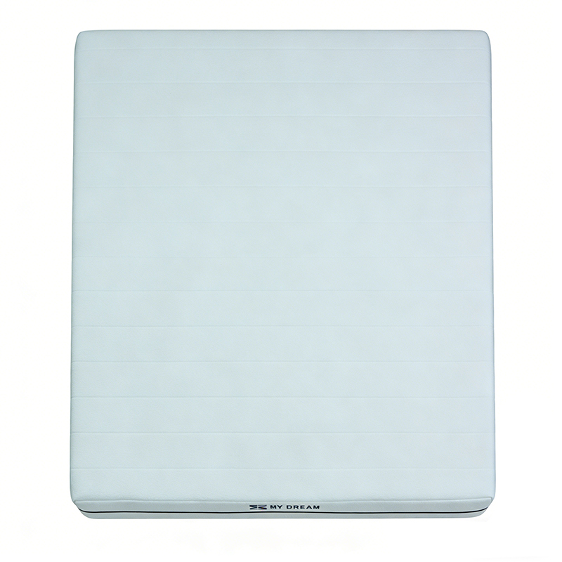 Top view of MX DREAM roll-pack compressed foam mattress showing textured breathable cover