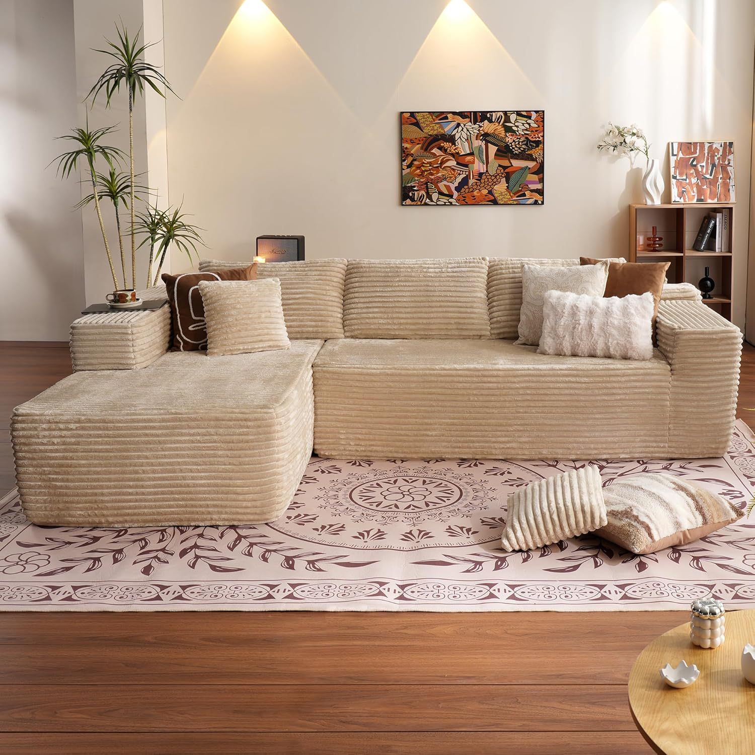 Modern cream-colored L-shape corduroy foam sofa in a stylish living room with warm lighting