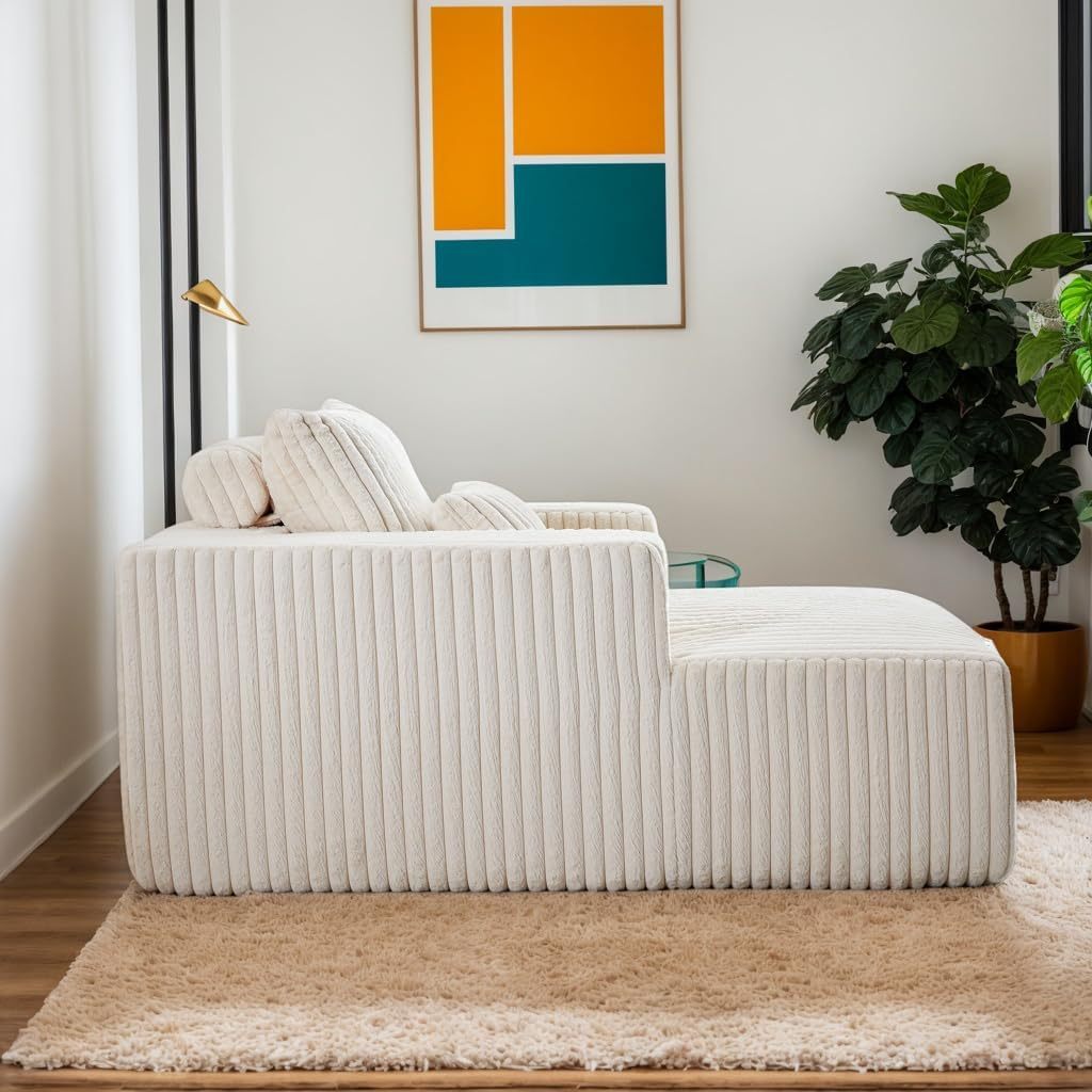 Side view of a minimalist modular foam chaise lounge showing the ergonomic profile and textured fabric